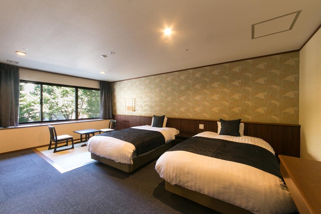 فندق جيرو أونسين سويميكان المظهر الخارجي الصورة A room at the hotel